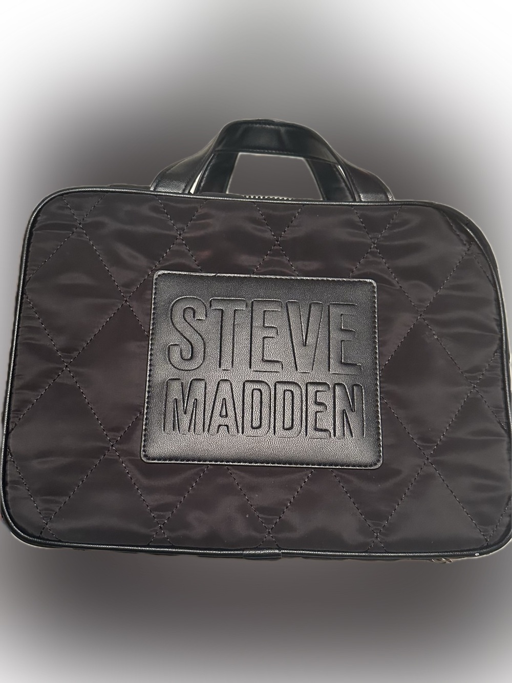Steve Madden Quilted Black makeup bag.